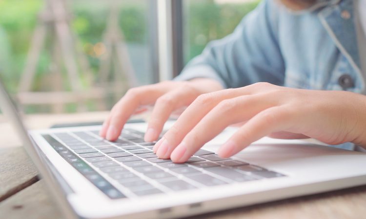 Business freelancer working on laptop